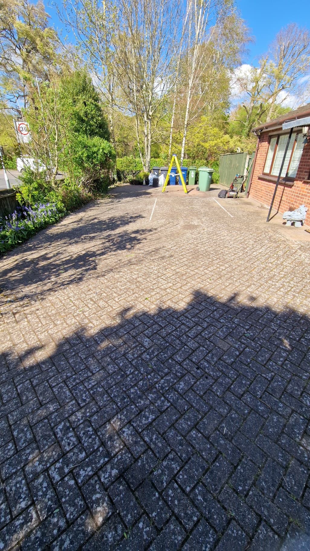 Clean driveway with cleared borders after ELawnCare garden clearance service in Cambridge